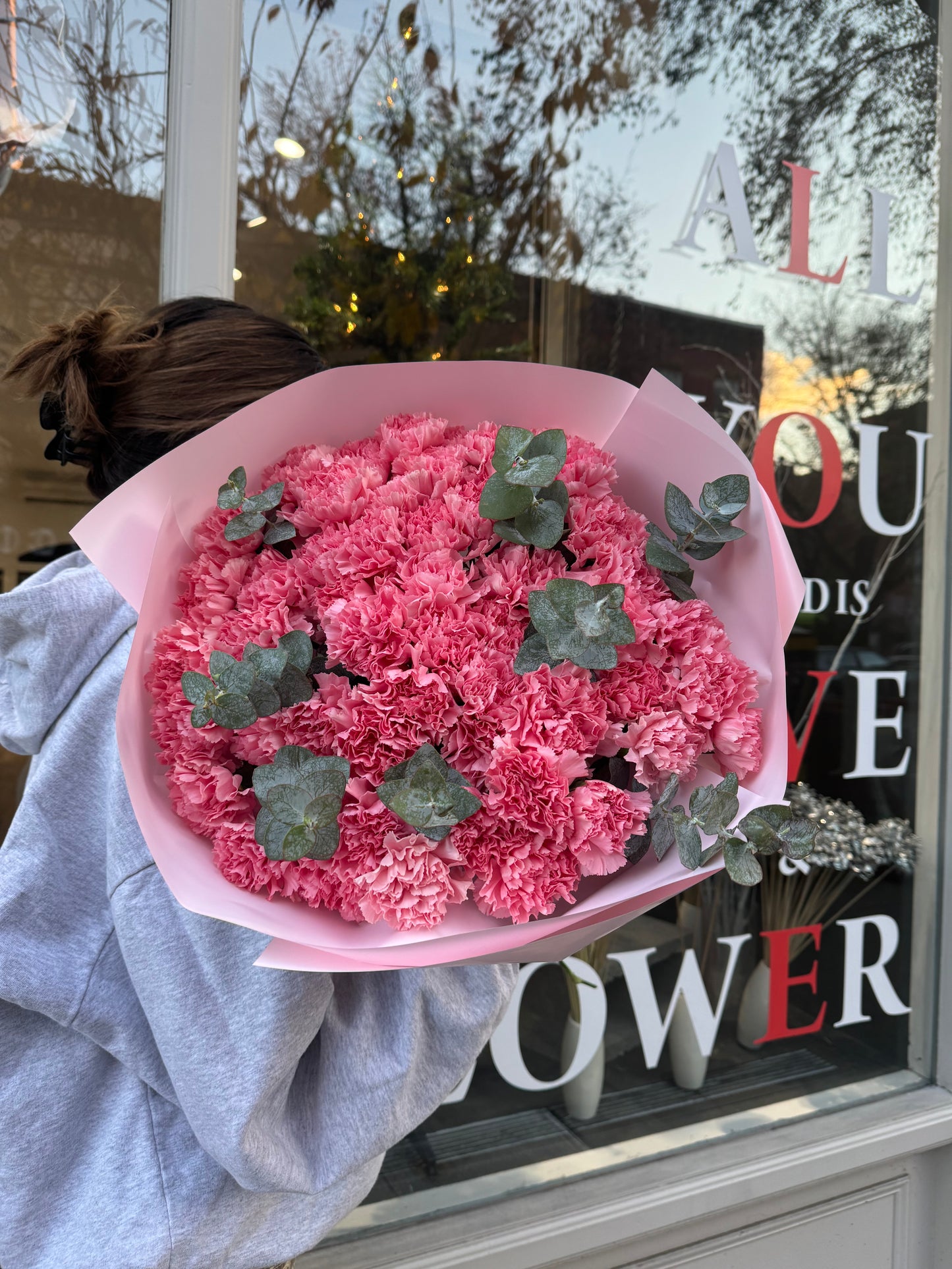 Bouquet of pink dianthuses and eucalyptus