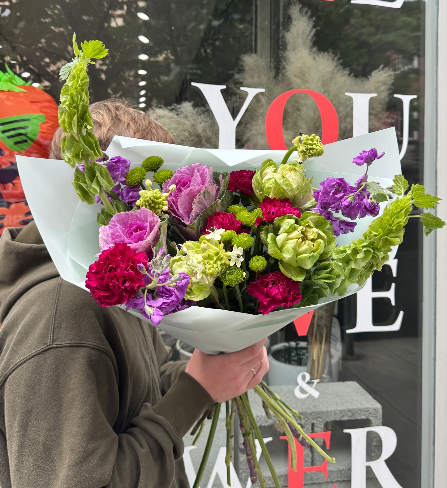 “Urban Bloom” Bouquet (Brassica, stocks, cushion, dianthuses, ornitogalum, bells of Ireland, veggie rose)