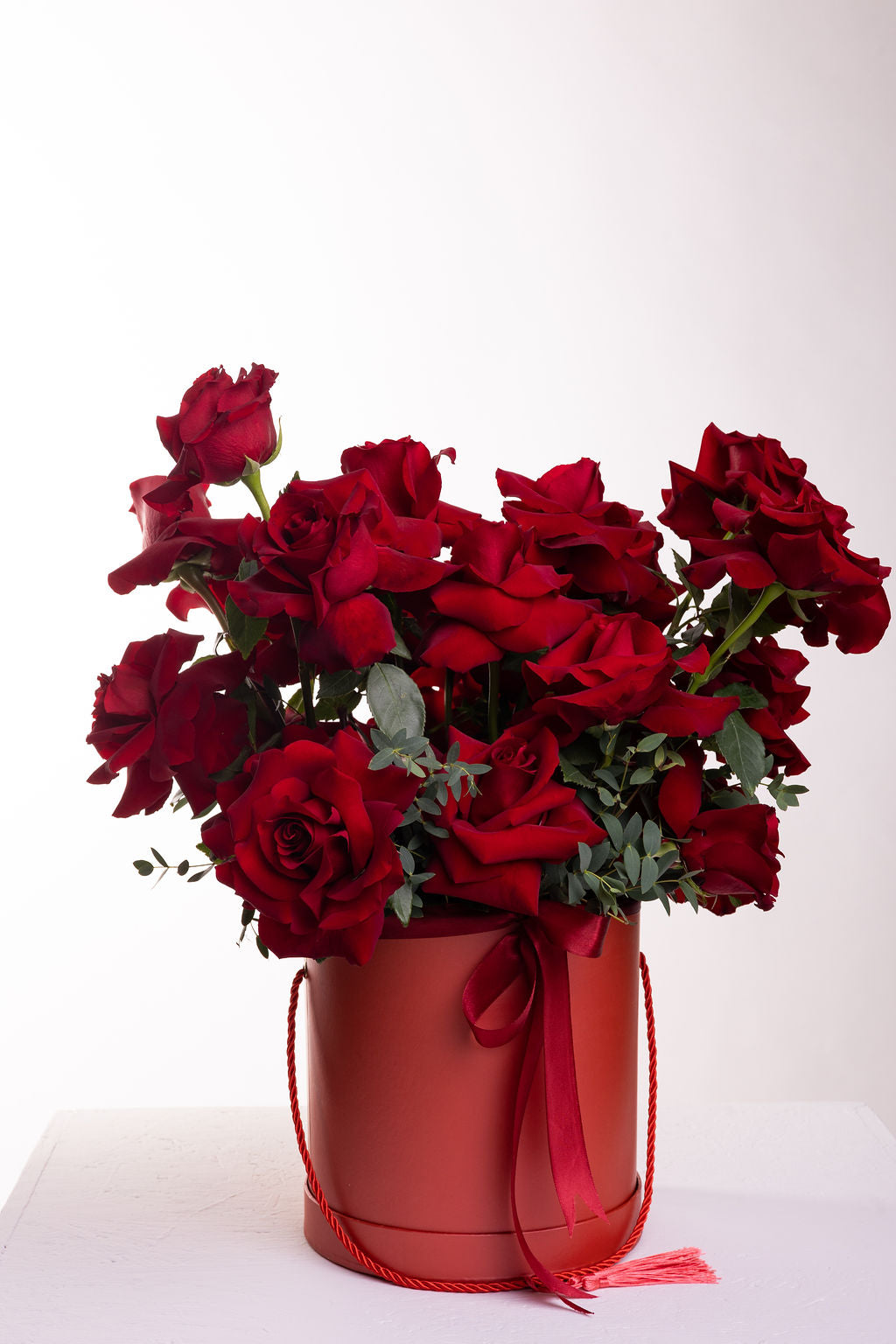 Box of Explorer roses & eucalyptus