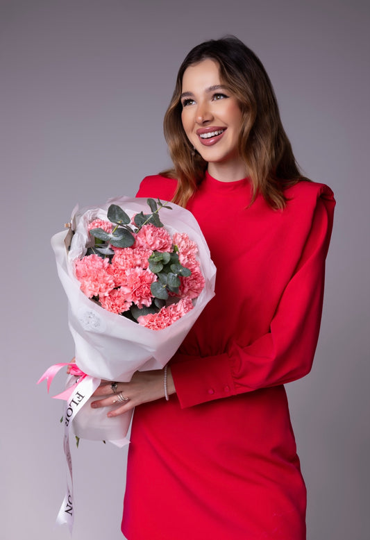 Bouquet of pink dianthuses and eucalyptus