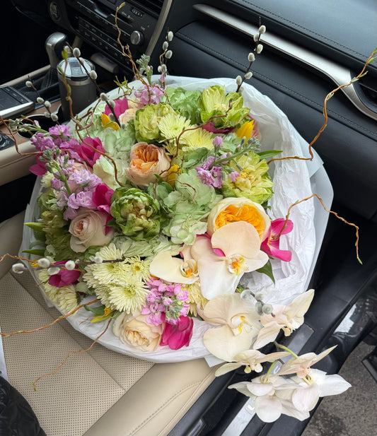 Dopamine Bouquet ( Phalenopsis, garden roses, veggie roses, stocks, branches, pussy willow, tulips, hydrangeas, cushion)