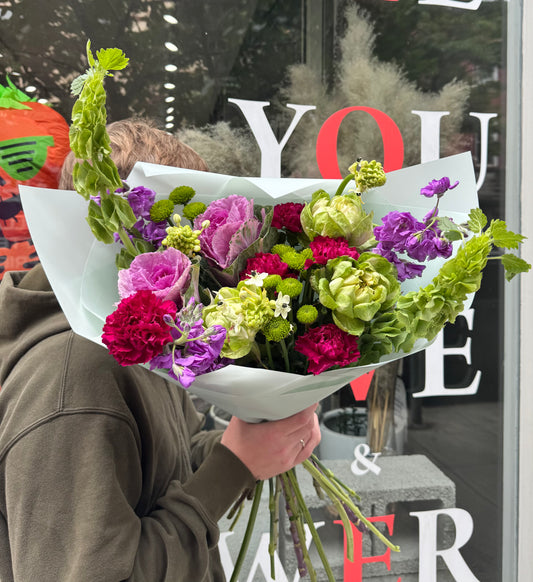 “Urban Bloom” Bouquet (Brassica, stocks, cushion, dianthuses, ornitogalum, bells of Ireland, veggie rose)