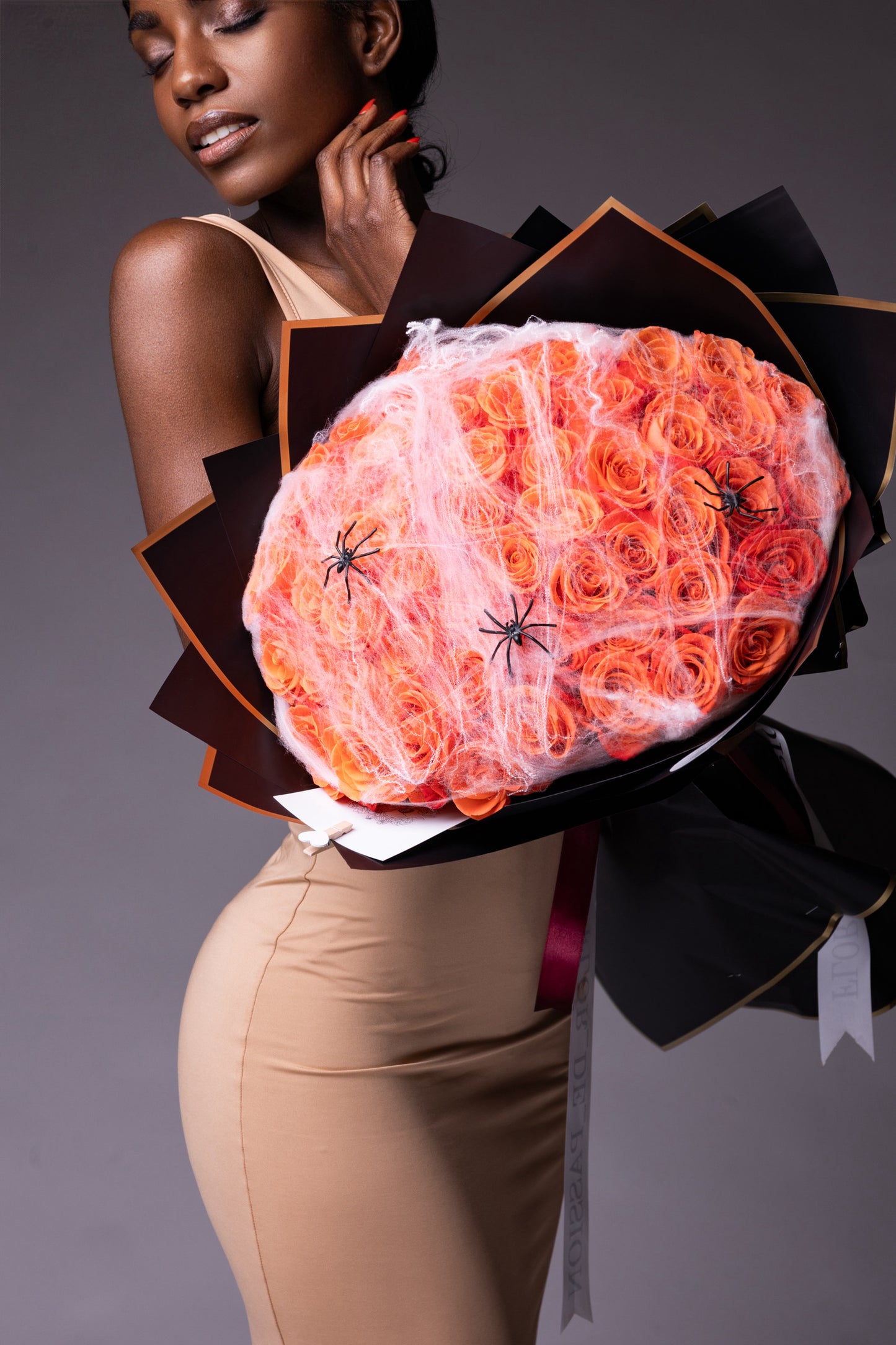 Orange Roses with webs and spiders